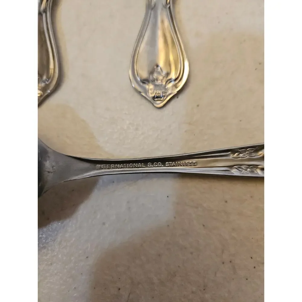 Lot of 4 stainless serving forks by International Silver Co floral flower design